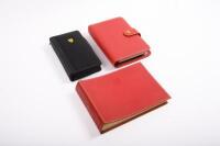 NOTEBOOKS & ORGANIZERS: A group of three high quality Ferrari branded notebooks/personal organizers
