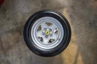 FERRARI 308: An excellent standing table using a c1985 Ferrari 308 '165 TR 390 Speedline SL129' wheel with fitted period Michelin tyre, table complete with glass top, 106cm tall, diameter of glass top 86cm - 7
