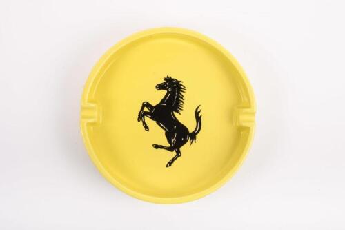 ASHTRAY: A large ceramic yellow Ferrari ashtray as used in distributorships, made in Italy by Bitossi, featuring prancing horse to face, 24cm diameter