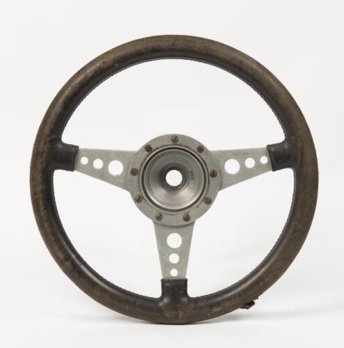 STEERING WHEEL: A Moto-Lita three spoke, leather bound steering wheel, 36cm in diameter