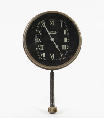 JAEGER: A rare Jaeger clock, with white Roman numeral numbering on a black face, 8cm in diameter