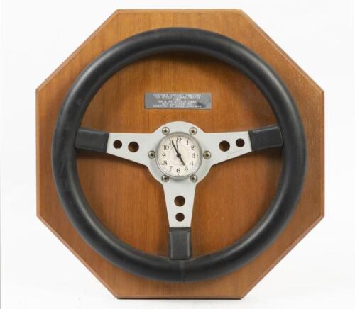 SPECO STEERING WHEEL: A three spoke Speco steering wheel trophy piece, comes with fitted clock to centre, awarded to first place holder in the SA & SB Sports Cars class at the October 1995 Foster's Historic Sandown event
