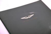 ASTON MARTIN GUIDE: A pair of factory issued publications by Dr Ulrich Bez including a guide to Aston Martin models and the 2000 Collection [Location: Sydney] - 6