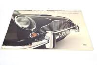 ASTON MARTIN 1998 CALENDAR: A large format factory Aston Martin calendar from 1998 (61cm x 46cm), together with an unframed 1997 factory poster covering the David Brown (56cm x 42cm), both in fair condition and a copy of the 2002 Goodwood Revival event pr - 2