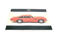 ASTON MARTIN 1998 CALENDAR: A large format factory Aston Martin calendar from 1998 (61cm x 46cm), together with an unframed 1997 factory poster covering the David Brown (56cm x 42cm), both in fair condition and a copy of the 2002 Goodwood Revival event pr - 4