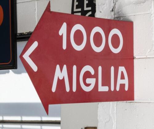 MILLE MIGLIA: A circa 1990s&nbsp;double sided enamel flange sign '1000 Miglia' directional arrow sign, 32cm high, 65cm wide