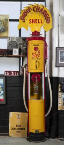 SHELL: A superbly restored 1920s manual petrol pump in 'Shell Motor Spirit' livery complete with&nbsp;plastic illuminated&nbsp;'Clamshell' globe surrounded by enamelled 'Super-CHARGED' wreath&nbsp;sign.
