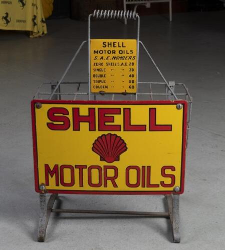 SHELL: A lovely original c1930s Shell eight bottle rack with original 'SHELL&nbsp;MOTOR&nbsp;OILS' enamel sign to front and small enamel 'S.A.E. Numbers' chart sign below handle.