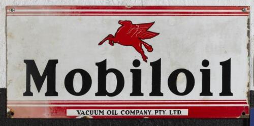 MOBIL: An original Australian Mobiloil ten bottle rack front enamelled sign, 27cm high, 58.5cm wide