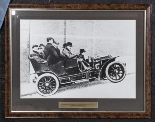 ROLLS ROYCE: A framed reproduced photograph of Claude Johnson performing a hill start in a Rolls Royce 20hp&nbsp;on a 1 in 6 gradient hill, 66cm high, 84cm wide
