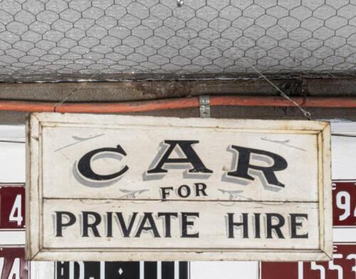 PRIVATE HIRE: An early hand painted double sided wood 'Car for Private Hire' sign 28cm high, 62cm wide