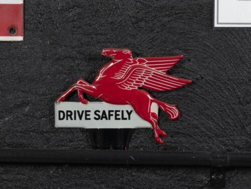 MOBIL: A reproduced Mobil Pegasus 'Drive Safely' number plate topper badge, 14cm high, 16cm wide