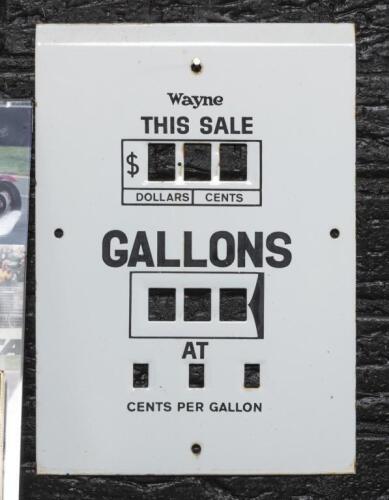WAYNE: An enamelled Wayne petrol pump&nbsp;face plate measuring 'This Sale' in dollars/cents, amount of Gallons and&nbsp;price per gallon in cents, 32cm high, 23cm wide. As used on model 70 Wayne pumps.
