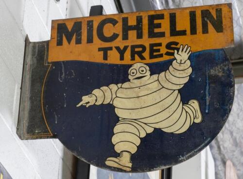 MICHELIN TYRES: A desirable c1920s-1930s double sided post mount 'Michelin Tyres' sign featuring Bibendum&nbsp;54.5cm high, 61cm wide