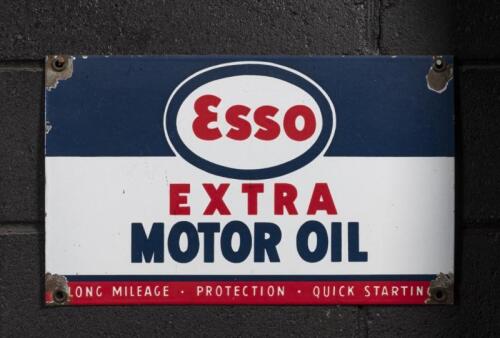 ESSO: An original enamel 'Esso - Extra - Motor Oil' eight bottle oil rack sign, 27cm high, 44cm wide
