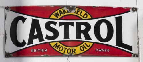 CASTROL WAKEFIELD: An original "Castrol Wakefield Motor Oil, British Owned" twelve bottle rack enamel sign, 31cm high, 74cm wide