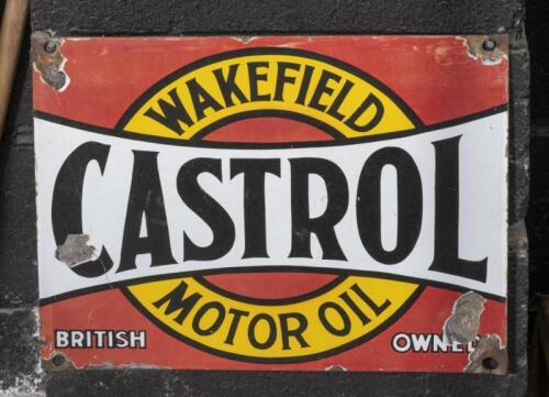 CASTROL: An original 'Castrol Wakefield Motor Oil' six oil bottle rack front enamel sign, 30.5cm high, 38cm wide