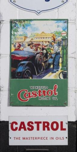 CASTROL: Two modern Castrol signs comprising a large&nbsp;tin 'Castrol Wakefield Motor Oil' sign with early scene depicted and a smaller enamel 'Castrol 'The Masterpiece in Oils' sign, largest 45cm high, 30cm wide.