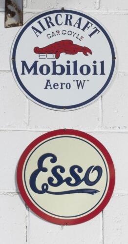 SIGNS: Two modern round signs comprising an&nbsp;'Esso' tin sign and a 'Gargoyle Mobiloil Aircraft Aero W' enamel sign, largest 30cm diameter