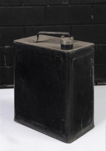 FUEL CANS: A pair of fuel cans, red one is Caltex 'light of the age' kerosine, black one is plain but has a brass embossed Esso screw on top, both 2 gallon in capacity