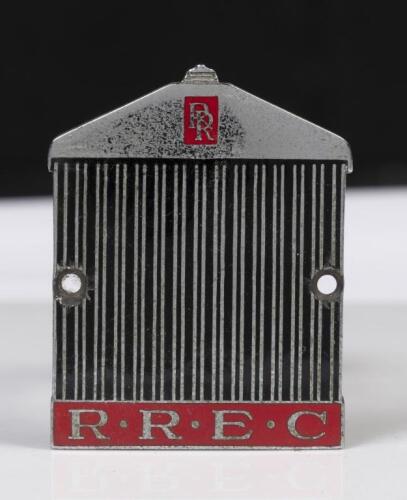ROLLS ROYCE: An enamel Rolls Royce enthusiasts club grille badge, has had holes drilled into each side, 7cm high, 6cm wide&nbsp;
