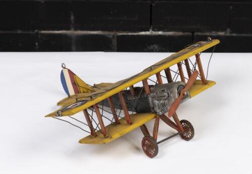 CURTISS JN JENNY: A handmade tinware Curtiss JN Jenny biplane, 40cm long, wingspan 45cm