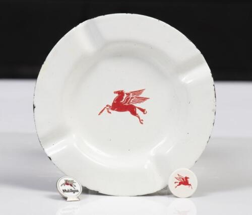 MOBIL: A trio of Mobil related items, an enamel&nbsp;ash tray 12cm in diameter, a 'Mobilgas' enamel hat pin,&nbsp;and a small disk 2cm in&nbsp; diameter,&nbsp;all with 'Pegasus' logo