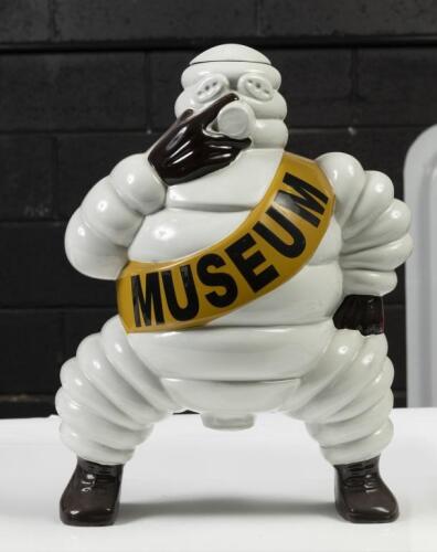 MICHELIN STATUE: A reproduction Michelin Bibendum compressor style figure, created for David by Peter Vandersluys, 'Museum' written to sash, 36cm high