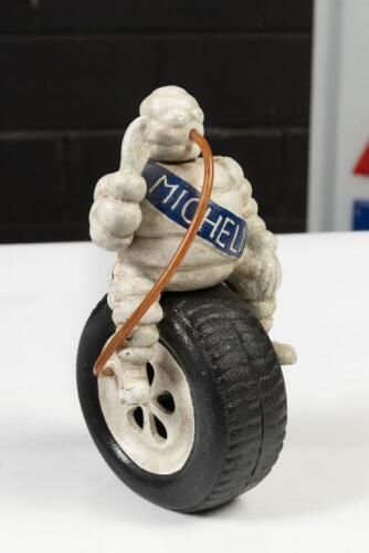 MICHELIN: A reproduction cast Michelin Bibendum figure sitting on tyre&nbsp;advertising mascot, 24cm high