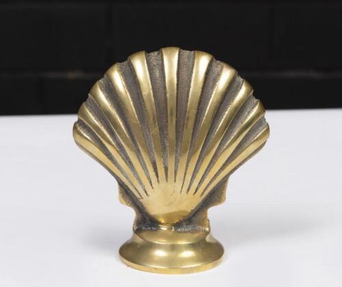 SHELL: A brass desk piece comprising Shell emblem on base, 12cm high overall