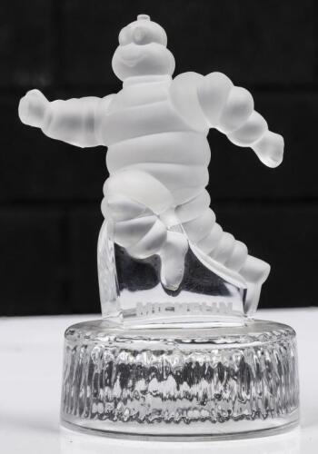 MICHELIN: A glass Michelin Bibendum statue on circular glass base, 20cm high