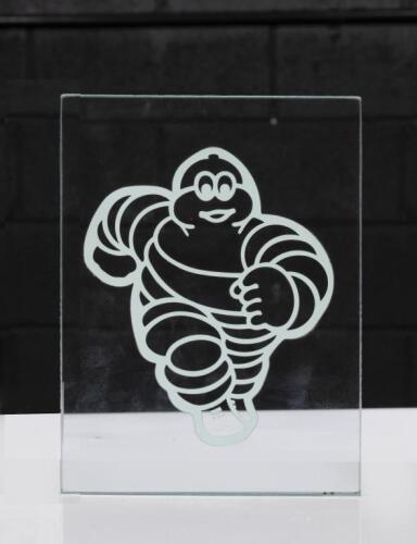 MICHELIN: A flat glass piece with a stamped Bibendum&nbsp;figure, 20cm high, 15cm wide
