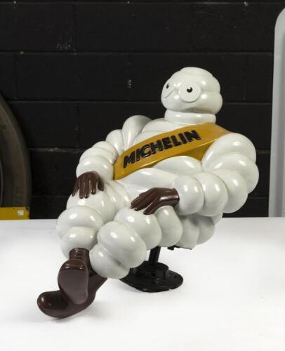 MICHELIN: A large circa 1950s/1960s restored&nbsp;seated Michelin Bibendum figure mounted to base, approx 46cm tall