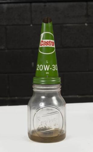 CASTROL: An original embossed glass 'Castrol' one pint bottle with Castrol 'L 20W-30 MS' grade tin top&nbsp;