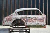 ASTON MARTIN DB2/4: A partial bodyshell, with hatchback and rear window glass plus some additional body parts [Location: Sydney]