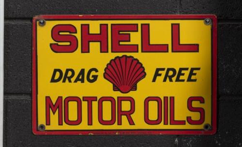 SHELL: A c1930s original enamel Shell 'Drag Free' Motor Oils eight bottle oil rack sign, 18cm high, 42.5cm wide - [SALEROOM NOTICE]