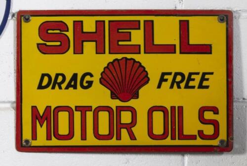 SHELL: A c1930s original enamel Shell 'Drag Free' Motor Oils eight bottle oil rack sign, 18cm high, 42.5cm wide - [SALEROOM NOTICE]