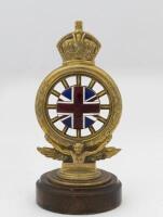 R.A.C: A Royal Automobile Club full members badge, by Elkington & Co Ltd, London, circa late 1900s, brass with enamel Union Jack, numbered 'D71', mounted on wooden base, 17cm high overall