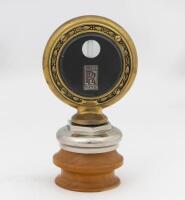 ROLLS_ROYCE: A c1900s Rolls-Royce brass radiator temperature gauge&nbsp;mounted on wooden base, gauge diameter 8.5cm, height 16cm overall