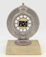 RACV: A Royal Automobile Club of Victoria front bumper members badge,Australian Blue Ensign centered on one side, RACV logo on reverse side, '4580' engraved to base
