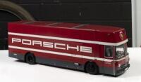 PORSCHE: A large 1:18 scale model of the 'Porsche Renntransporter'&nbsp; racing car transporter&nbsp;by Schuco, two levels with loading ramps, opening doors, spare wheel compartment and&nbsp;jack