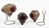 SIDE LAMPS: A group of three brass side lamps
