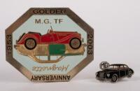 MG: Two badges relating to MG, a fine detailed octagon shaped grille badge 'GOLDEN ANNIVERSARY 1953-2003' showing and MG TF & Magnette models, 7cm high, 8.5cm wide and a MG Magnette lapel pin