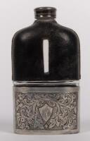 FLASK: A fine leather skinned glass flask with removeable silver plated beaker, 14cm high