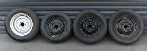 WHEELS: Three early English 14 inch, four stud wheels thought to be from a Morris Minor model, also includes one 15 inch, five stud wheel