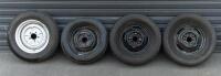 WHEELS: Three early English 14 inch, four stud wheels thought to be from a Morris Minor model, also includes one 15 inch, five stud wheel