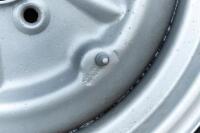 WHEELS: Three early English 14 inch, four stud wheels thought to be from a Morris Minor model, also includes one 15 inch, five stud wheel - 3