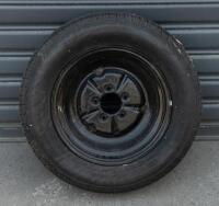 WHEELS: Three early English 14 inch, four stud wheels thought to be from a Morris Minor model, also includes one 15 inch, five stud wheel - 4