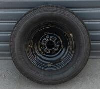 WHEELS: Three early English 14 inch, four stud wheels thought to be from a Morris Minor model, also includes one 15 inch, five stud wheel - 10
