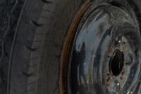 WHEELS: Three early English 14 inch, four stud wheels thought to be from a Morris Minor model, also includes one 15 inch, five stud wheel - 13